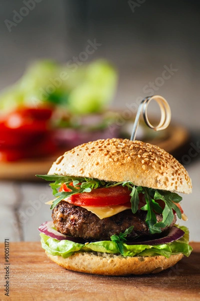 Obraz Delicious burgers with beef, tomato, cheese and lettuce
