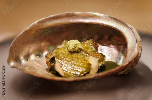 Fototapeta clam inside it's own shell with smoke culinary presentation expensive omakase food photography