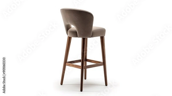 Fototapeta A stylish upholstered bar stool with a backrest and wooden legs set against a white background The design blends comfort with a contemporary look