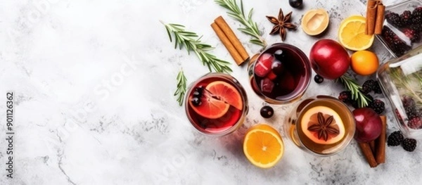 Fototapeta Mulled Wine with Spices and Citrus on a Marble Background