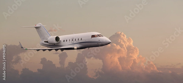 Fototapeta Private jet in the air with clouds in the background