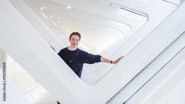 Fototapeta person standing in front of window