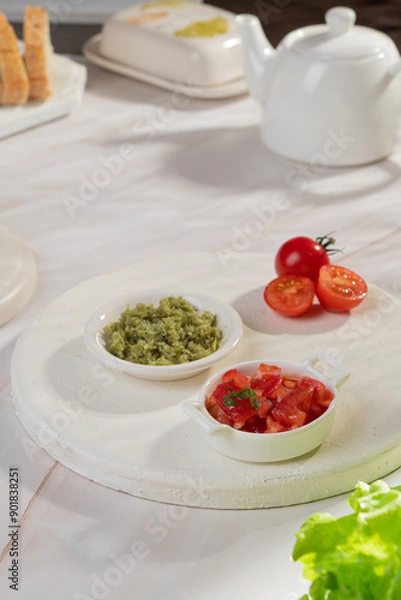 Fototapeta Vegetable sauces of different colors in bowls on a light background
