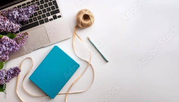 Fototapeta Flat lay top view office table desk laptop lilac flowers bouquet spool with beige and blue ribbon mint diary on white background