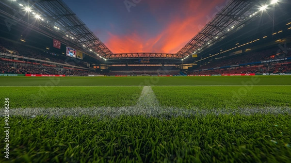 Fototapeta Vibrant Sunset Illuminates Packed Stadium During Exciting Soccer Match in Enthusiastic Atmosphere