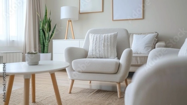 Fototapeta Beautifully staged and furnished modern living room with minimalist Scandinavian inspired design for an elegant and inviting real estate listing or property showcase