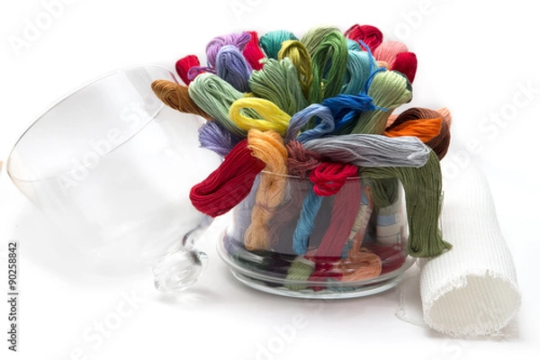 Fototapeta set of colored threads for embroidery, folded in a glass vase