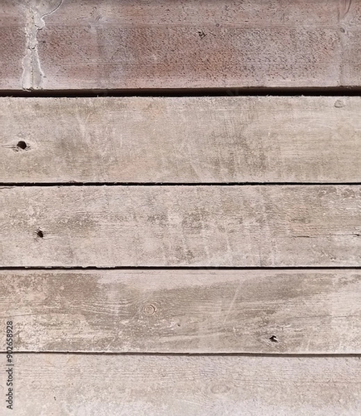 Obraz A few old planks lying horizontally, with gaps between several. 