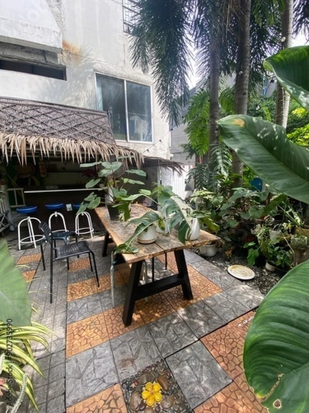 Obraz table and chairs in garden