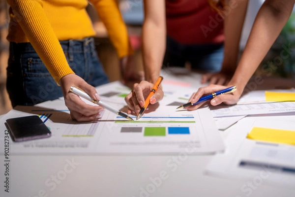 Fototapeta Marketing team working together analyzing financial charts and business data