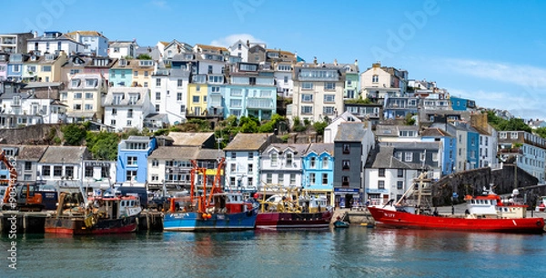 Fototapeta Colourful houses overlooking the harbour in the seaside town of Brixham on the Devon coast