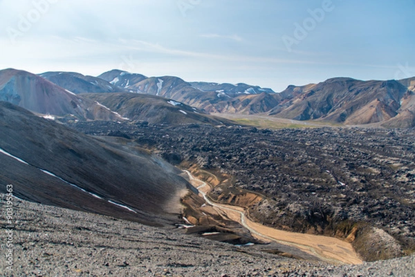 Fototapeta Hiking up the sulphur peak with views of old lava remains and river meandering through in Landmannalaugar in Iceland