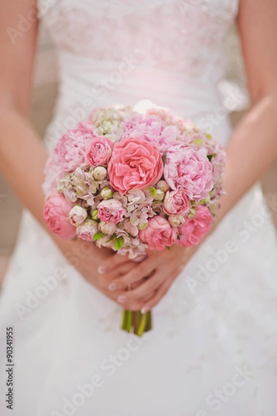 Obraz Wedding bouquet at bride's hands