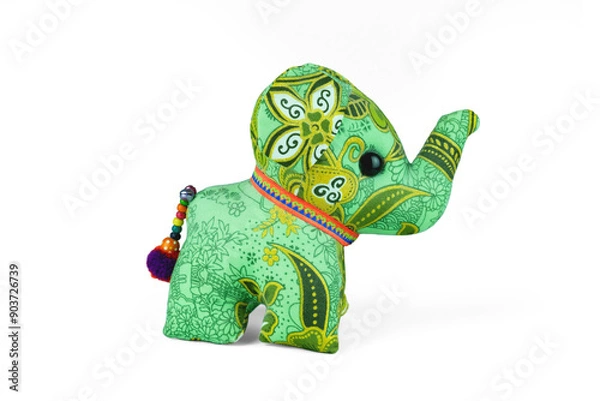 Fototapeta A green fabric elephant doll with Thai patterns design, bright colors and detailed motifs give it a handcrafted and artistic appearance, stand alone isolated on white background with clipping path.