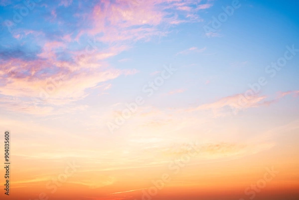 Fototapeta Beautiful , luxury soft gradient orange gold clouds and sunlight on the blue sky perfect for the background, take in everning,Twilight, Large size, high definition landscape photo