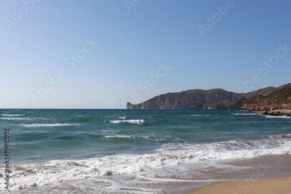 Obraz Waves Crashing on Sandy Beach with Rocky Hills
