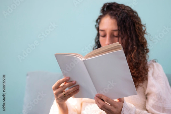 Fototapeta Curly girl reading a book mock up style