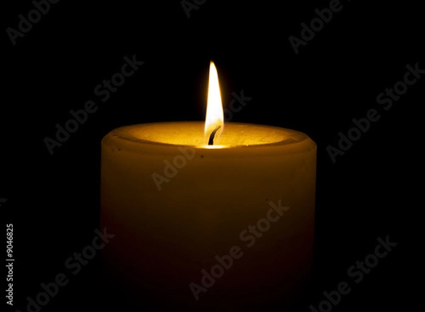 Fototapeta Candle on black background