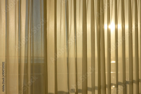 Fototapeta カーテン越しに見る朝日