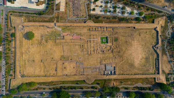 Fototapeta Aerial snapshot of a historical site, showcasing remnants of ancient architecture enclosed within formidable walls