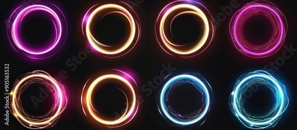 Fototapeta Set of eight vibrant glowing neon circles on a black background. Abstract circular light frames with bright colorful gradient