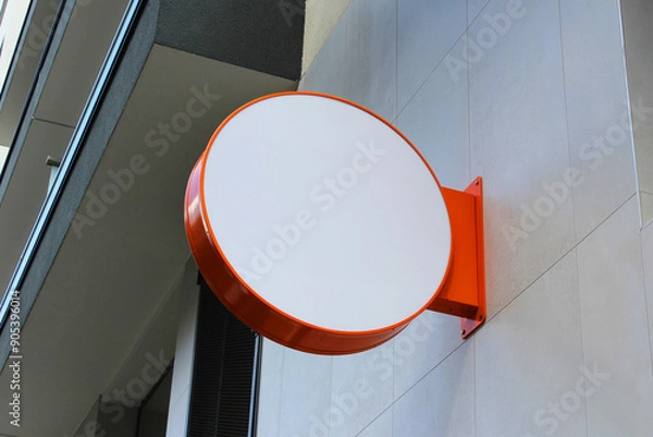 Fototapeta Rounded Street storefront shop, cafe, restaurant mounted signboard mock up design template. Blank white store sign design mockup.