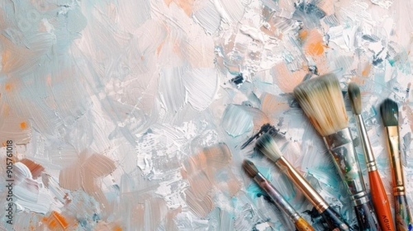 Fototapeta A set of artist's paintbrushes arranged on the right side of the image, with space on the left side for text. Perfect for art, painting, and creative projects.