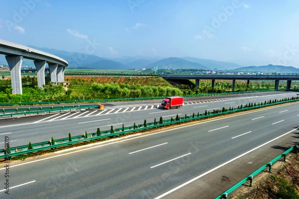 Fototapeta Highway and viaduct under the blue sky