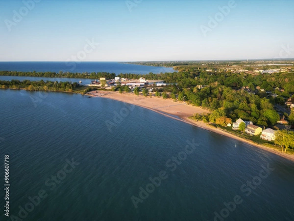 Obraz Aerial drone view of the popular recreational area, Sunset Beach. Located off the Welland Canal in Lake Ontario, St. Catharines, Ontario, Canada. Shot during a spring afternoon, May, 2023.