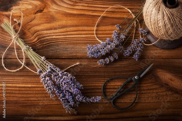 Fototapeta dried lavender bunches on dark wooden table