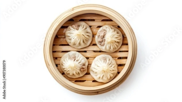 Obraz Steamed baozi dumplings filled with savory meat, top view in a bamboo steamer, isolated on white background for a clean look.