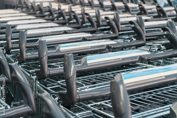 Obraz Supermarket trolleys lined up in a row