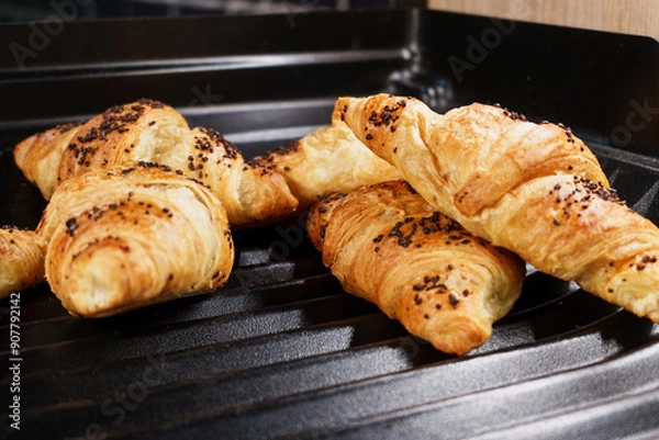 Obraz Freshly baked croissants with chocolate sprinkles