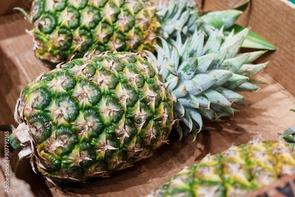Obraz Fresh pineapples in a box