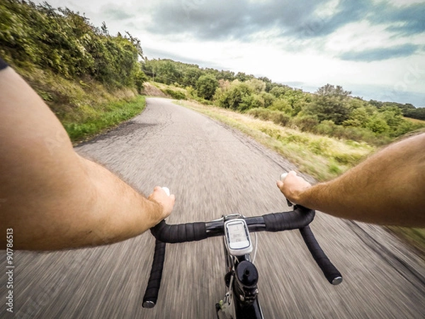 Fototapeta Going Down with Bicycle on the Road. pov, original point of view