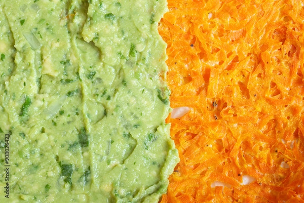Fototapeta Vibrant dual-texture culinary image showcasing fresh guacamole and shredded carrot. Food textures and colors.