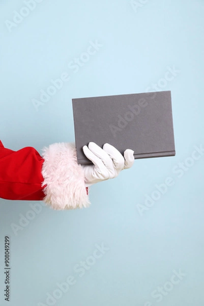 Obraz Santa holding book