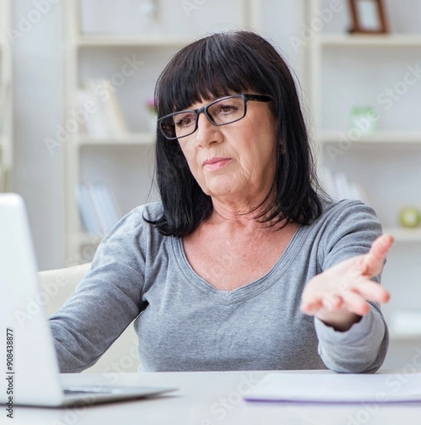 Obraz Senior woman struggling at computer