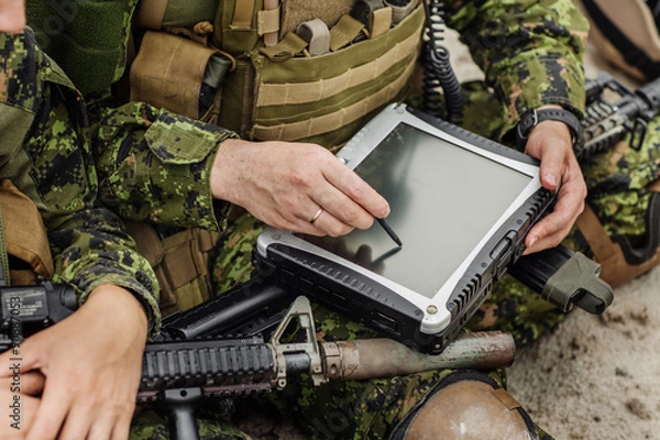 Fototapeta commander of the Rangers paves the route on an electronic satnav