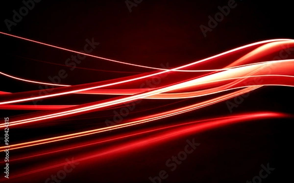 Fototapeta abstract of flowing light trails in vibrant shades of red and orange against a deep black background.