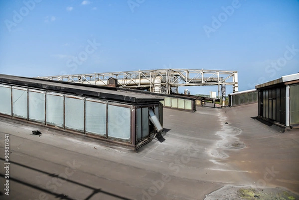 Fototapeta A Stunning Industrial Rooftop View Featuring Equipment Against a Beautiful Clear Sky