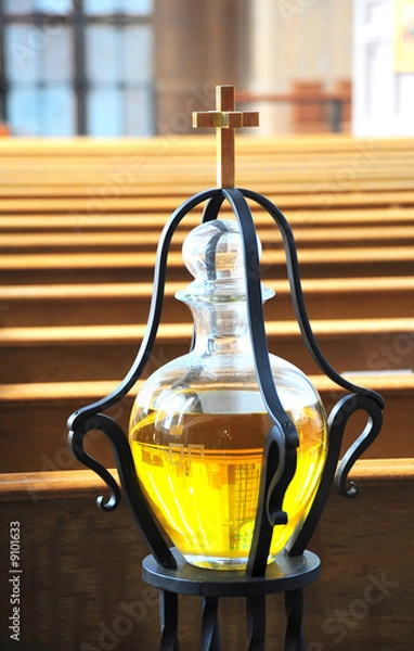 Fototapeta Cross and anointing oil inside a church.