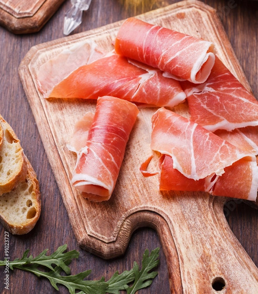 Fototapeta Curled Slices of  Prosciutto .selective focus