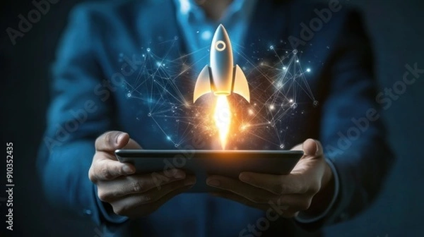 Fototapeta Businessman Holding a Tablet with a Rocket Taking Off, Representing Success and Growth