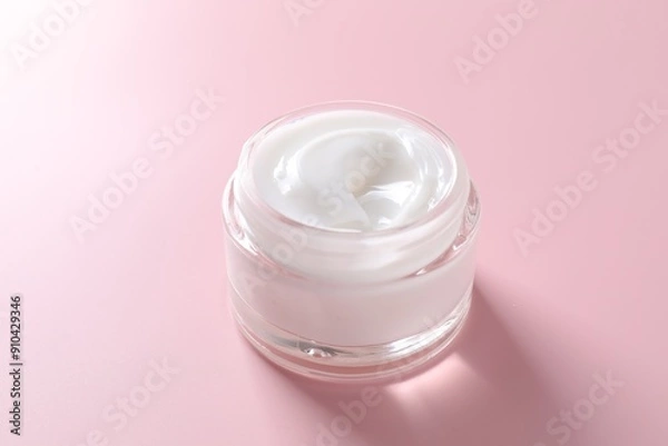 Fototapeta Face cream in jar on pink background, closeup
