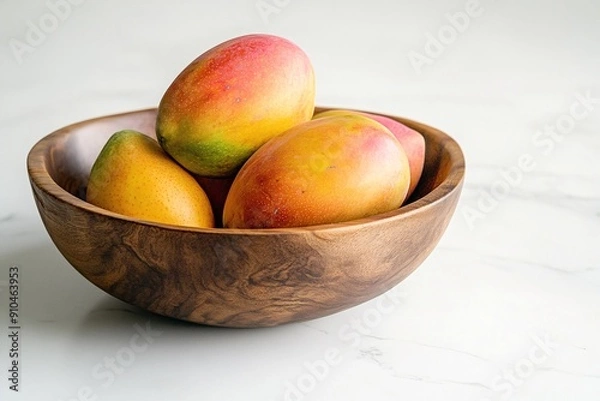 Obraz Fresh ripe mangoes in rustic wooden bowl on white background