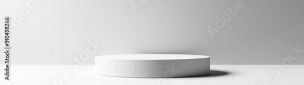 Fototapeta White Cylindrical Platform on a White Surface with a White Wall Behind