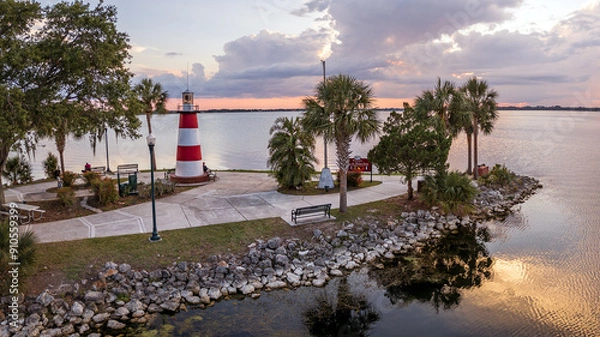 Fototapeta Photograph of sun setting in Mount Dora, Florida, USA. May 18, 2023. Lighthouse