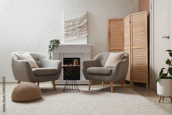 Fototapeta Interior of living room with armchairs, fireplace and soft carpet