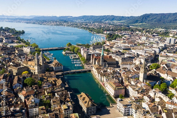 Fototapeta Zurich, Switzerland: Stunning aerial view of Zurich old town and downtown along the Limmat river and lake Zurich in Switzerland largest city